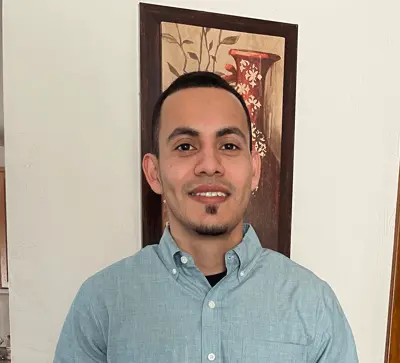 A professional headshot of Cesar Wilson